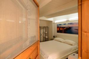 Postel nebo postele na pokoji v ubytování Le Dimore di Mariuccia Relax & SPA