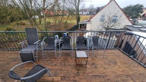 a group of chairs sitting on a balcony at Apartment with parking in Berlin 11 in Berlin