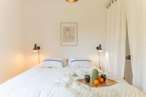 Postelja oz. postelje v sobi nastanitve Bel appartement lumineux à Biarritz