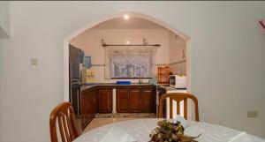 Kuchyň nebo kuchyňský kout v ubytování Chez Benoit Self Catering