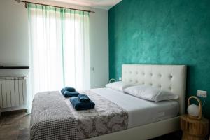 Postel nebo postele na pokoji v ubytování Villa De Alberti