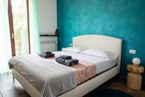 Postel nebo postele na pokoji v ubytování Villa De Alberti