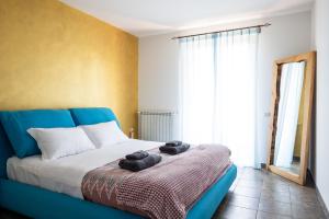 Postel nebo postele na pokoji v ubytování Villa De Alberti