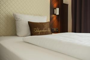 Postel nebo postele na pokoji v ubytování Hotel Schopenhauer Hof