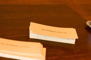 a couple of papers sitting on top of a table at Mimosa Hotel in Westerland (Sylt)