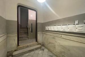 a bathroom with a mirror and stairs in a building at SingularStays Roger de Flor in Valencia