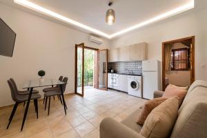 A kitchen or kitchenette at Ariadni Villas Faliraki