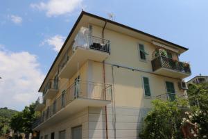 a yellow building with two balconies on it at Affittacamere DA MARIA TERESA in Sestri Levante