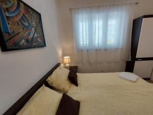 Ein Bett oder Betten in einem Zimmer der Unterkunft Apartment Dina