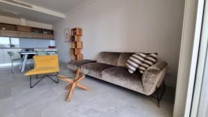 a living room with a couch and a table at Lustica Lux in Tivat +11 photos