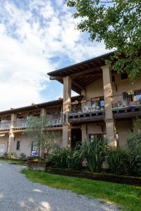 a building with balconies on the side of it at Agriturismo B&B Cascina Reciago in Desenzano del Garda