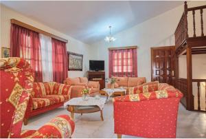 a large living room with couches and a table at Villa - Farmhouse in Oropos
