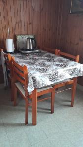 a table with a black and white table cloth on it at Apartment Ana in Opatija