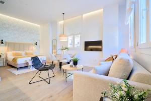 Televízia a/alebo spoločenská miestnosť v ubytovaní Lofts Parque de Huelin