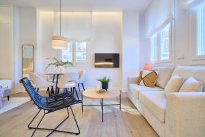 Televízia a/alebo spoločenská miestnosť v ubytovaní Lofts Parque de Huelin