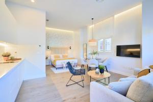 Televízia a/alebo spoločenská miestnosť v ubytovaní Lofts Parque de Huelin