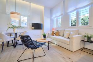 Televízia a/alebo spoločenská miestnosť v ubytovaní Lofts Parque de Huelin