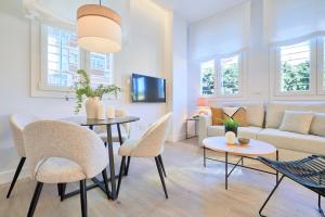 Televízia a/alebo spoločenská miestnosť v ubytovaní Lofts Parque de Huelin