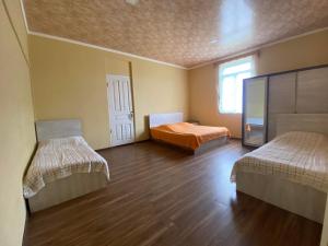 Letto o letti in una camera di Natia Guest House