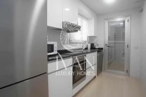 Kuchyň nebo kuchyňský kout v ubytování Casa Indigo Ivan Luxury Homes 9ªPlta Sur 1ªLinea