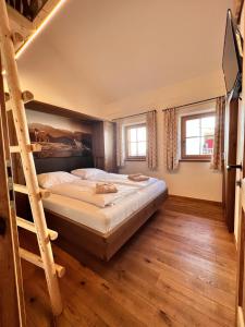 Voodi või voodid majutusasutuse FIRSTpeak Chalets toas