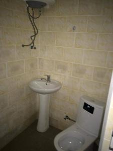a bathroom with a toilet and a sink at Ureki გურიის ქუჩა 47ბ in Ureki