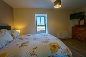 Letto o letti in una camera di Carrig Island Lodge