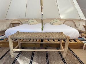 A bed or beds in a room at Tres Estrellas Costa Brava