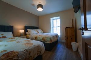 Letto o letti in una camera di Carrig Island Lodge