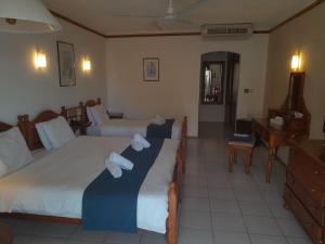 Voodi või voodid majutusasutuse Cornucopia Hotel toas