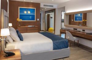 A bed or beds in a room at Nana Princess Suites Villas & Spa
