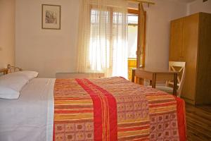Voodi või voodid majutusasutuse Albergo Ristorante Iris toas