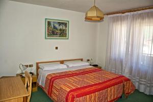 Voodi või voodid majutusasutuse Albergo Ristorante Iris toas