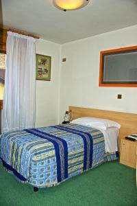 Voodi või voodid majutusasutuse Albergo Ristorante Iris toas
