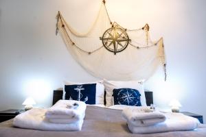 Ένα ή περισσότερα κρεβάτια σε δωμάτιο στο Whale Apartment & SPA +39 φωτογραφίες
