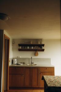a kitchen with a sink and a counter top at Lūķi, Lauku sēta in Jūrkalne +101 photos