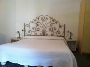 Postel nebo postele na pokoji v ubytování Hotel Pensione Moderna