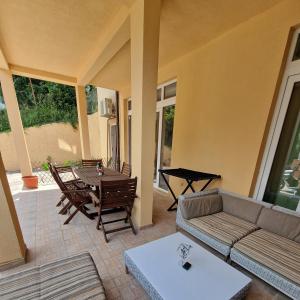 a living room with a couch and a table at Apartments Panorama in Kotor