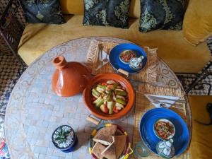 a table with plates of food on top of it at Dar saafia in Marrakech