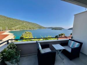 a balcony with a view of a body of water at Villa Iva Lastovo in Ubli
