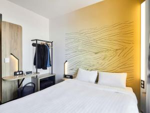 Postel nebo postele na pokoji v ubytování B&B HOTEL Argenteuil