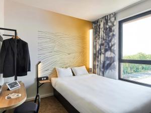 Postel nebo postele na pokoji v ubytování B&B HOTEL Argenteuil