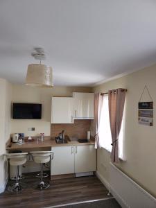 a small kitchen with a table and a window at Lovely Private Room in Dublin