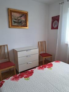 Postel nebo postele na pokoji v ubytování Vilma A2 plus 1