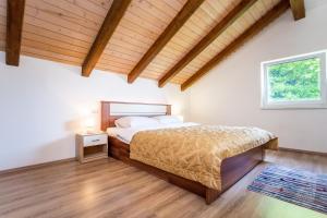 Postel nebo postele na pokoji v ubytování Apartmani Cerovečki