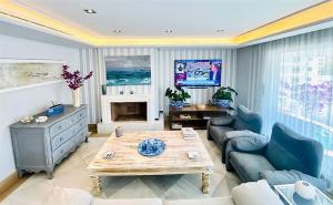 a living room with a couch and a coffee table at SUPERIOR 3 bedroom MARBELLA center close to beach in Marbella