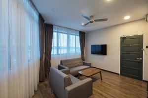 TV a/nebo společenská místnost v ubytování SkyCity Motel Pulau Ketam