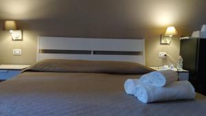 Postel nebo postele na pokoji v ubytování CconfortHotels R&B Cavour