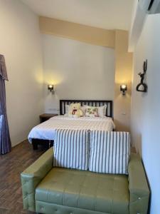 Ένα ή περισσότερα κρεβάτια σε δωμάτιο στο Wonderful Kenting Hostel
