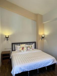 Ένα ή περισσότερα κρεβάτια σε δωμάτιο στο Wonderful Kenting Hostel